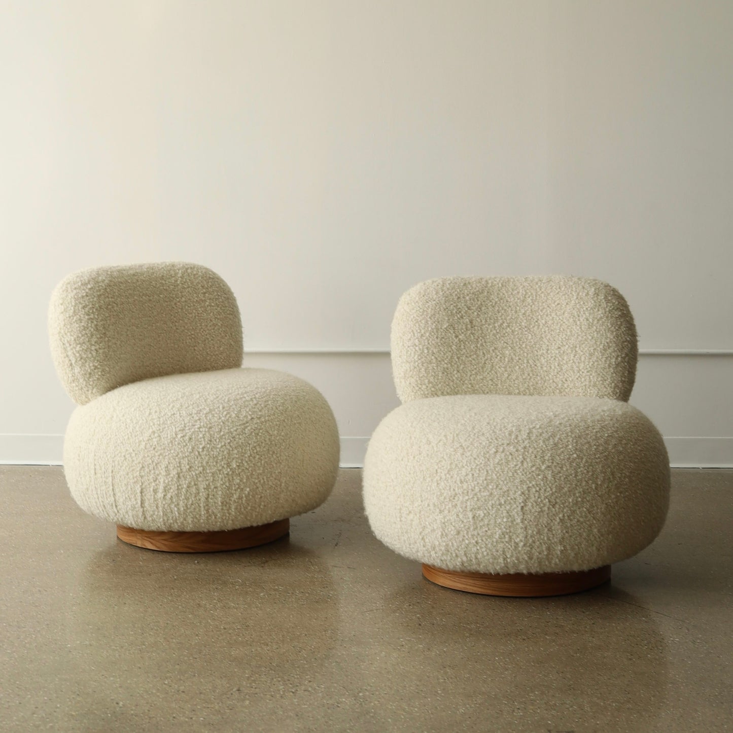 Steve Chase Swivel Poufs, a pair